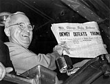 Truman showing the "Dewey Defeats Truman" headline