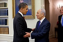 Photo of Obama shaking hands with Israeli President Shimon Peres, with Biden overlooking