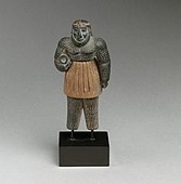 Monstrous male figure; late 3rd–early 2nd millennium BC; chlorite, calcite, gold and iron; height: 10.1 cm; Metropolitan Museum of Art