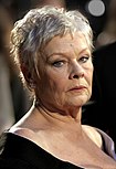 A picture of Judi Dench smiling towards the camera