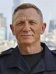 A picture of Daniel Craig smiling towards the camera