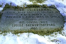 A stone memorial plaque that reads: "Love is Eternal – RADM Alan Bartlett Shepard Jr * US Navy * America's First man in Space 1998 – His loving wife Louise Brewer Shepard 1998"