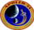 The circular patch depicts the Earth and the Moon. An astronaut lapel pin leaves a comet trail from the liftoff point on Earth. Around it is the logo "Apollo 14 – Shepard Roosa Mitchell"