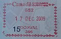 蒙特婁多佛爾國際機場入境印章，那是皮埃爾·埃利奧特·特魯多國際機場的舊稱。此印章由加拿大國際機場的護照管制官員使用。