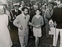 Selassie holding hands with future Indian Prime Minister Rajiv Gandhi