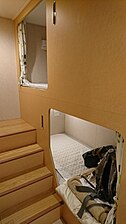 A second-class cabin on the ferry connecting Tokyo and Kitakyushu. A simple bed with curtains.(Ocean Tokyu Ferry, 2019)
