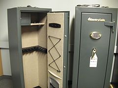 A large gun safe for rifles and shotguns. An internal lockbox for ammunition is fitted at top left