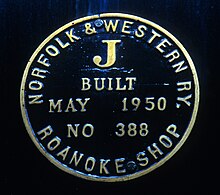 A close-up of a steam locomotive's builder's plate