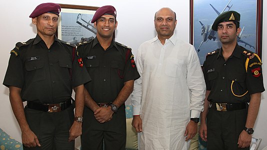 Deepak Rao, M. S. Dhoni, and Abhinav Bindra (right) with then Minister of State for Defence M. M. Pallam Raju after joining TA in 2011.