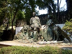 Statue of Gonzalo Guerrero in native dress with two young children