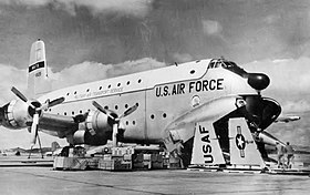 A C-124 being loaded with a disassembled F-104 for transport