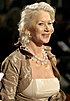 Helen Mirren at the Orange British Academy Film Awards in 2007, facing to the right, waring a pearl necklace and smiling