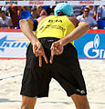 Image 10Brazil's Emanuel Rego signals for an "angle" block for the opposing player on the left and a "line" block for the opposing player on the right (from Beach volleyball)