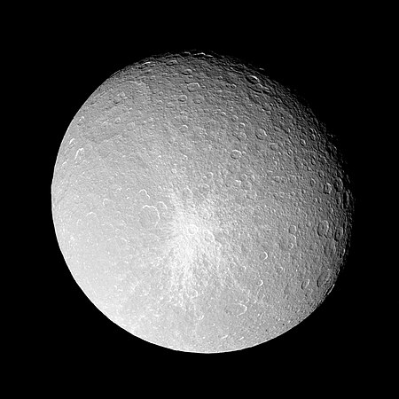 View of Rhea's leading hemisphere with crater Inktomi and its prominent ray system just below center; impact basin Tirawa is at upper left