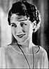 Promotional photograph of Norma Shearer smiling and looking to the left