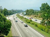 A dual highway with greenery on either side