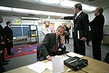 President Bush on the telephone gathering information
