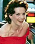 Juliette Binoche at the 2000 Cannes Film Festival, wearing a red dress and smiling