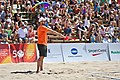 Image 8A linesman signals that a ball is "in" (from Beach volleyball)