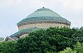 The dome of the Gould Memorial Library can be seen above the trees from many locations in Upper Manhattan