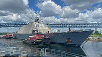 USS Little Rock getting towed into Philadelphia Navy Yard by tug boats