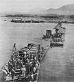1006th Seabees using a Three-Section Pontoon Causeway at Safta Beach in September 1943.
