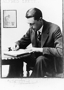 Photograph of Leete drawing at his desk